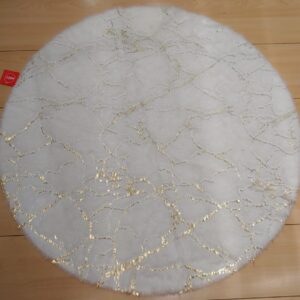 alfombra redonda marmoleada blanca