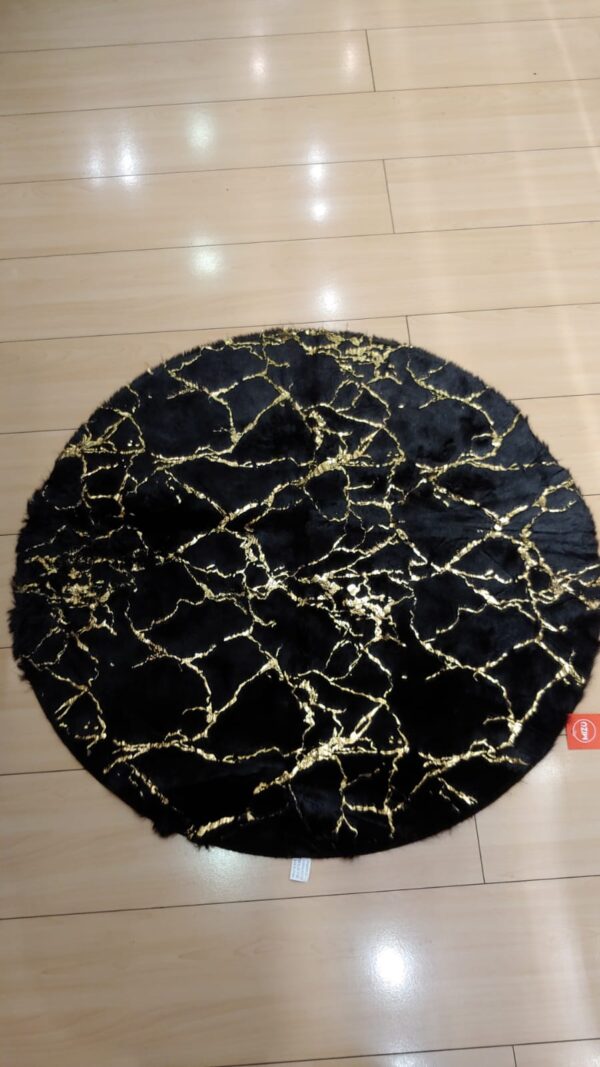 alfombra redonda negra marmoleada
